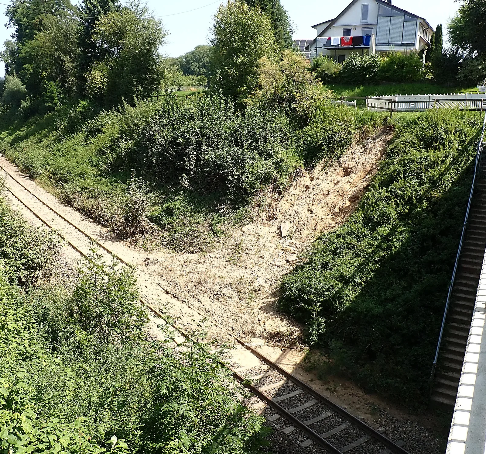 A landslide on a railway cutting slope beside the track